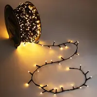 Spetebo Fiaccole da esterno su tamburo oro soft 22 m con spina - 750 LED - Fiaccole natalizie con doppio timer e 8 funzioni